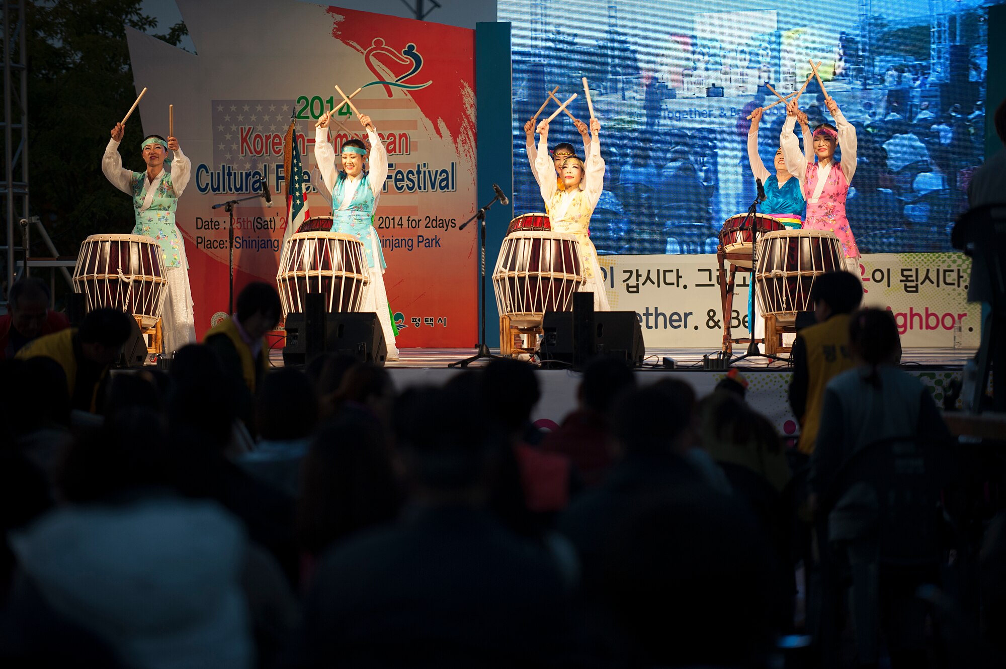 Korean women perform a traditional Korean drum routine during the 11th Korean American Friendship Cultural Festival at the Songtan Entertainment District, Republic of Korea, Oct. 25, 2014. Drums play an important part in traditional Korean music. (U.S. Air Force photo by Senior Airman Matthew Lancaster)