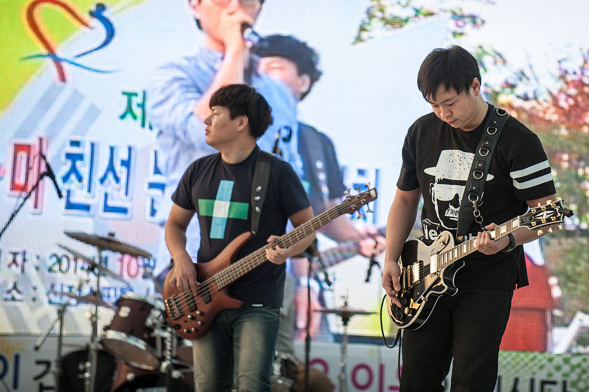 Members of a Korean band play guitars during the 11th Korean American Friendship Cultural Festival at the Songtan Entertainment District, Republic of Korea, Oct. 25, 2014. A variety of different groups entertained the festival audience with a range of musical performances. (U.S. Air Force photo by Senior Airman Matthew Lancaster)