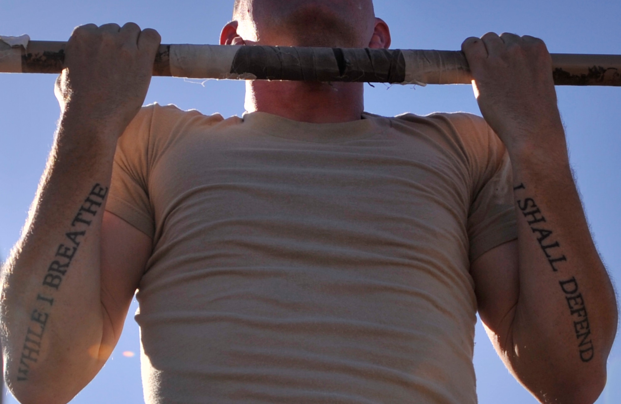 A Ranger Assessment Course student performs pull ups during a physical fitness assessment Oct. 2, 2014, on Nellis Air Force Base, Nevada. RAC is the first step for Airmen who want to go to U.S. Army Ranger School. About 80 percent of the Airmen who graduate RAC and go to Ranger school complete it and receive the Ranger tab. (U.S. Air Force photo by Airman 1st Class Christian Clausen/Released)