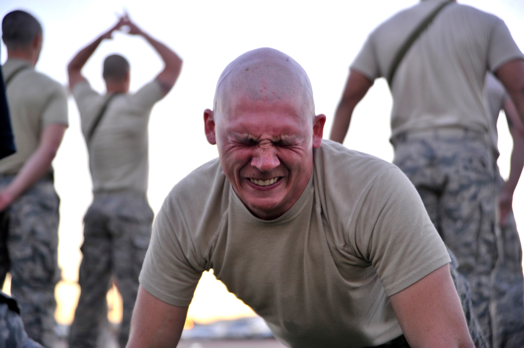 Senior Airman Joseph Massoglia 10th Security Forces Squadron, United States Air Force Academy, Colorado, performs pushups during a physical fitness assessment Oct. 2, 2014, on Nellis Air Force Base, Nevada. RAC is a two week-long leadership course designed to prepare Airmen for U.S. Army Ranger school and puts the participants through extreme physical, mental and emotional stress. (U.S. Air Force photo by Airman 1st Class Christian Clausen/Released)