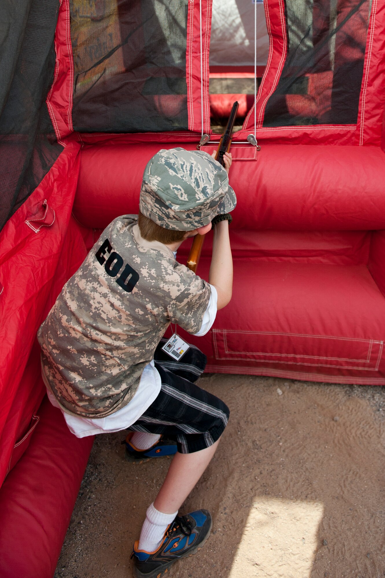 Connor Farkus, age 10, son of Tech Sgt. Kara Deacon, 607th ACS, qualifies to fire during the sixth annual Operation Kids event at Luke Air Force Base, Arizona, Oct. 25, 2014. Operation Kids is a simulated deployed exercise for kids to help them understand the things their parents do when preparing for a deployment and what it’s like to be in a deployed environment. (U.S. Air Force photo by Staff Sgt. Staci Miller)