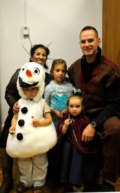 Senior Airman Travis Joyner, 90th Munitions Squadron, and his family showed off their family-wide, "Frozen" costumes during the Warren ICBM and Heritage Museum's  "Night at the Museum" Oct. 24 into a family ordeal by coordinating a family-wide costume theme Oct. 24. One of the events during the night was a costume contest, where children and adults were awarded candy and trinkets for dressing up. (U.S. Air Force photo by Airman 1st Class Brandon Valle)
