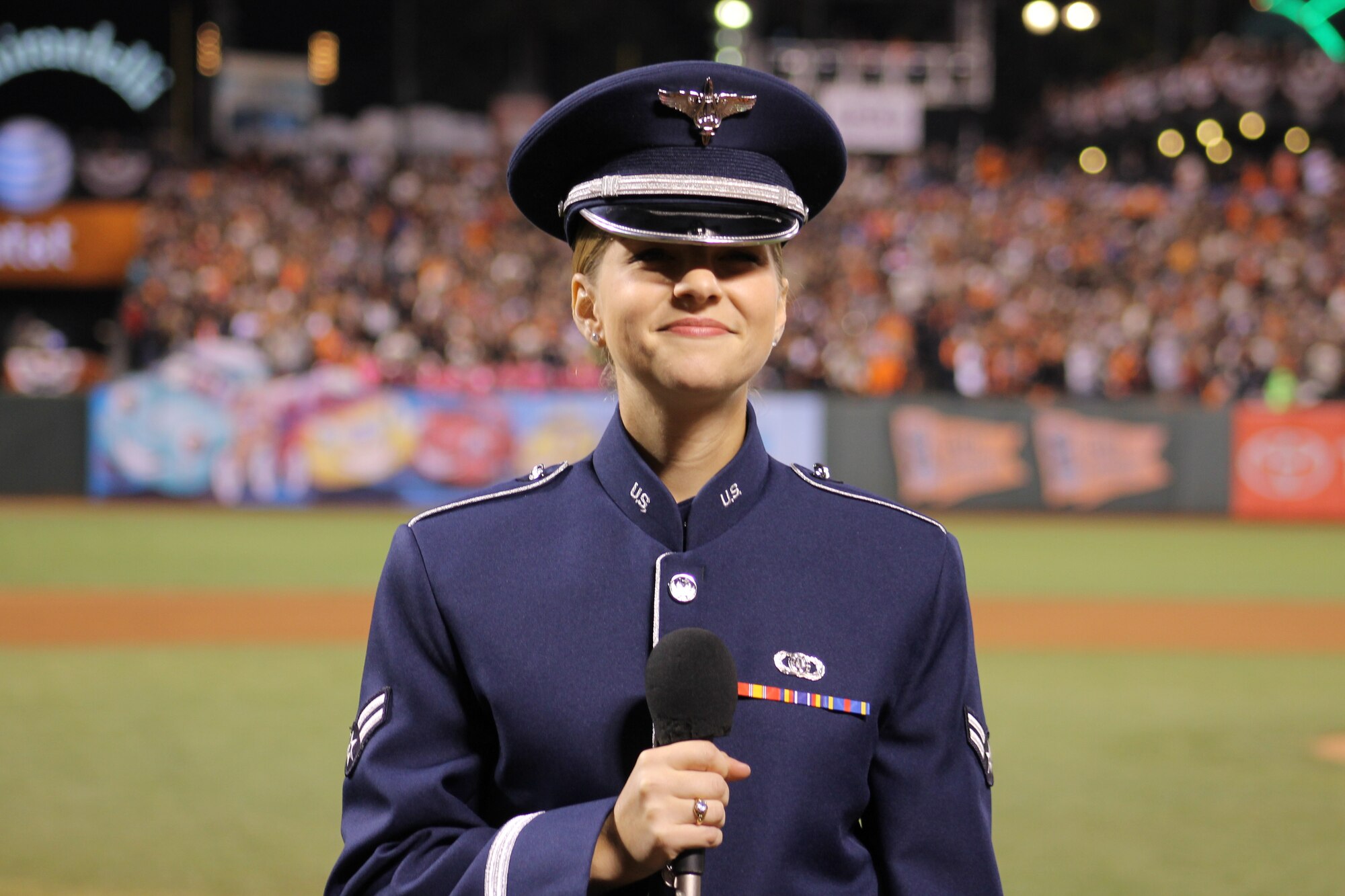 Airman 1st Class Michelle Doolittle, U.S. Air Force Band of the Golden West vocalist, sings "God Bless America" Oct. 26, 2014, during the seventh-inning stretch of Game Five of the World Series. She represented the Airmen from Travis Air Force Base and the Air Force at the game. (Courtesy photo)