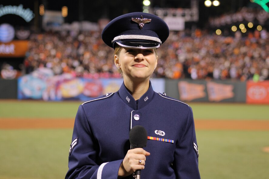 Airman 1st Class Michelle Doolittle, U.S. Air Force Band of the Golden West vocalist, sings "God Bless America" Oct. 26, 2014, during the seventh-inning stretch of Game Five of the World Series. She represented the Airmen from Travis Air Force Base and the Air Force at the game. (U.S. Air Force photo by Staff Sgt. Megan May) 
