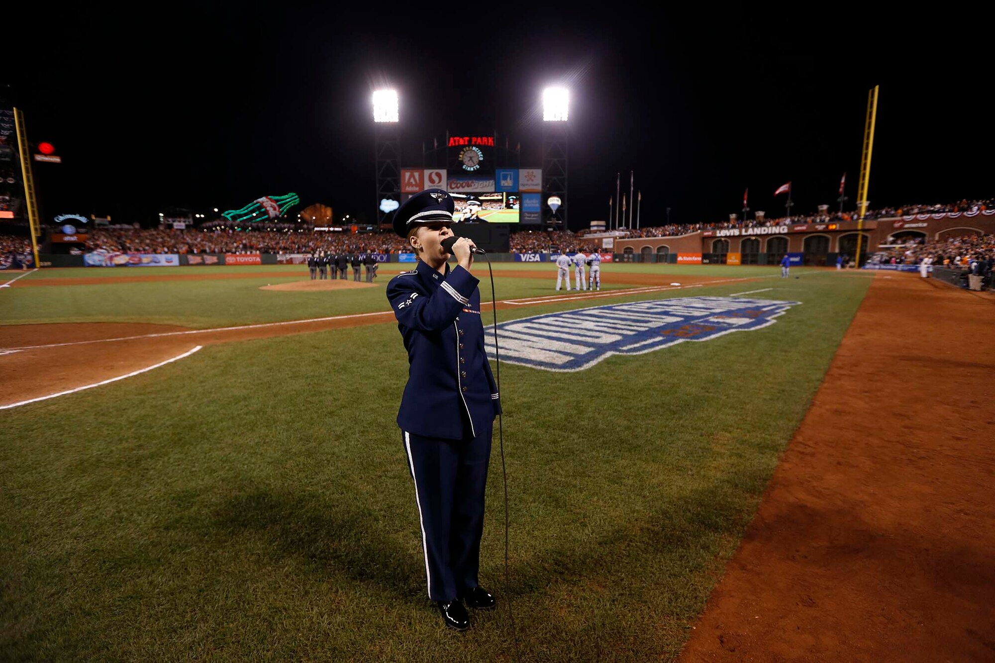 Airman 1st Class Michelle Doolittle, U.S. Air Force Band of the Golden West vocalist, sings "God Bless America" Oct. 26, 2014, during the seventh-inning stretch of Game Five of the World Series. She represented the Airmen from Travis Air Force Base and the Air Force at the game. (Courtesy photo)
