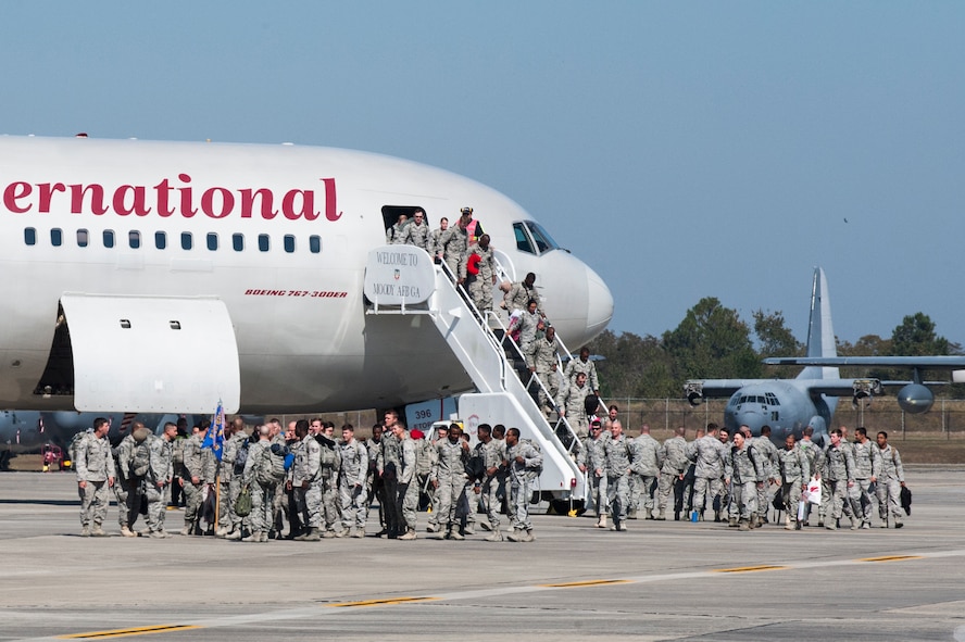 Members from the 824th Base Defense Squadron return from a deployment Oct. 26, 2014, at Moody Air Force Base, Ga. The 824th BDS provides fully-integrated, capable and responsive forces to the Expeditionary Air Forces. (U.S. Air Force photo by Airman 1st Class Dillian Bamman/Released)