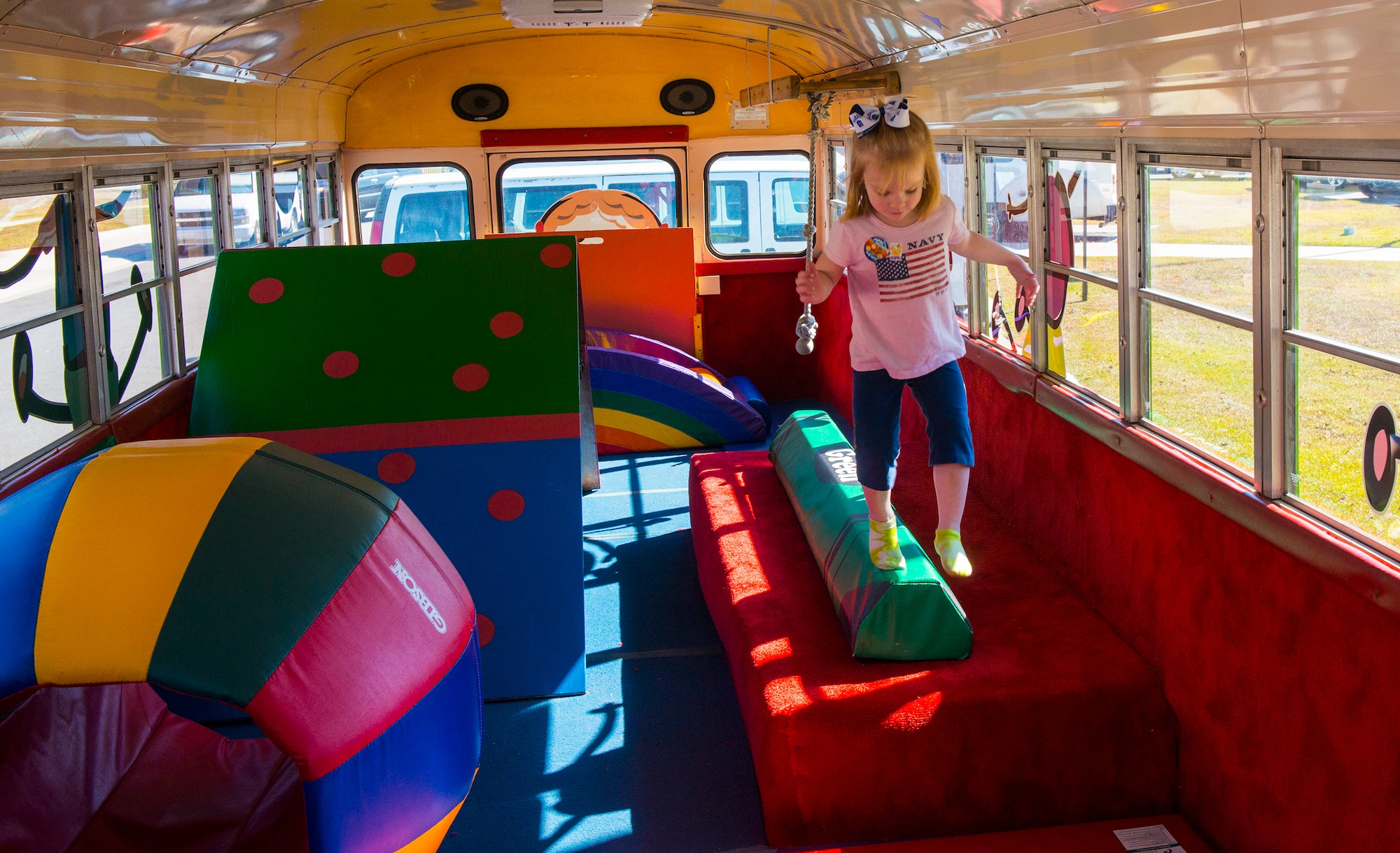 Jayleigh, daughter of U.S. Air Force Staff Sgt. Jerry Michaels, 23d Communications Squadron, walks on a balance beam during the 4th Annual Child Expo Oct. 25, 2014, at Moody Air Force Base, Ga. The expo introduced various extracurricular activities to parents and children that can be found in the community. (U.S. Air Force photo by Airman 1st Class Ceaira Tinsley/Released)