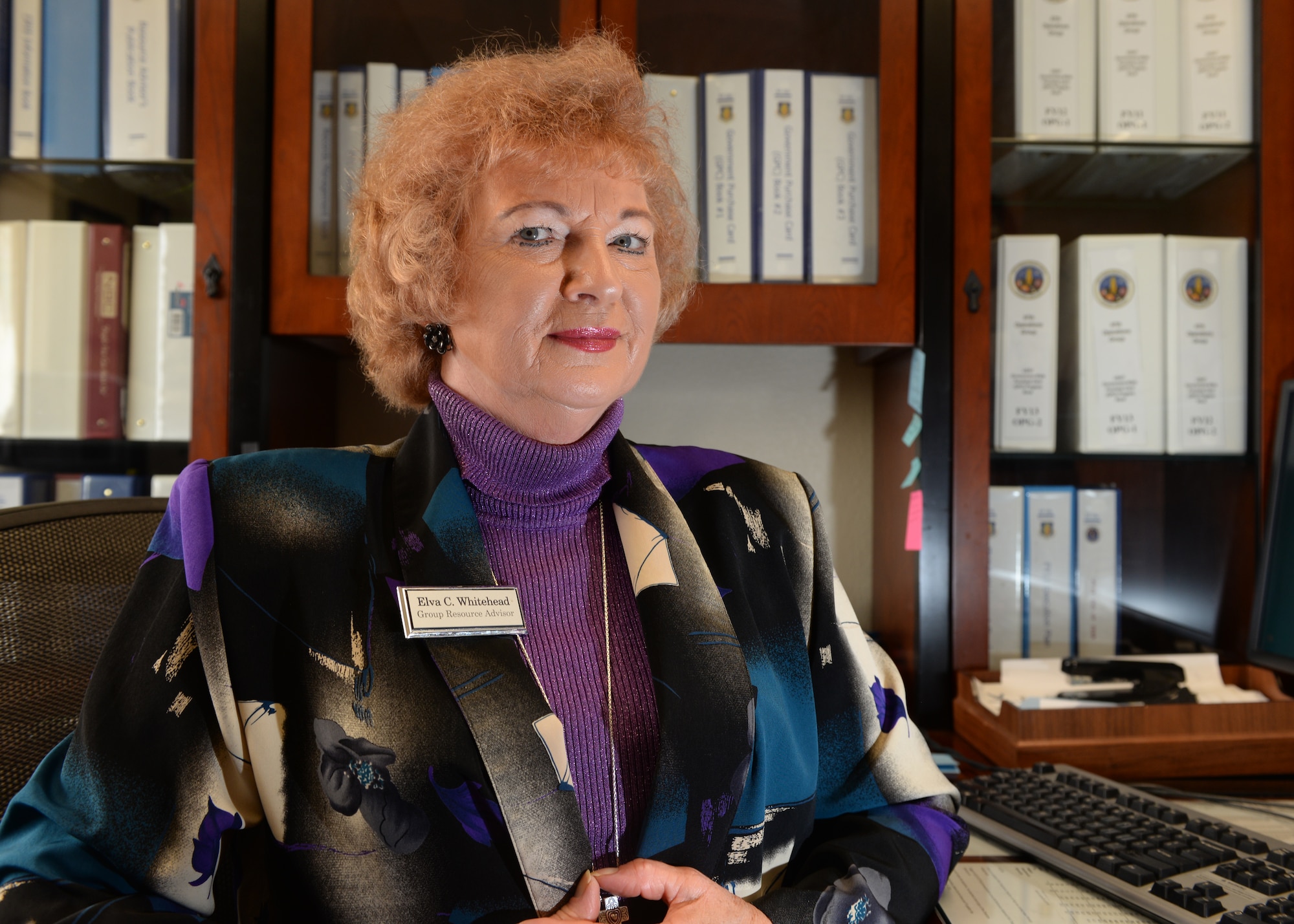 ALTUS AIR FORCE BASE, Okla. – Elva Whitehead poses for a photo in her office at the 54th Air Refueling Squadron Oct. 27, 2014. Whitehead is the 97th Operations Group resource advisor and will be retiring after 36 years of service on Nov. 3, 2014. (U.S. Air Force photo by Senior Airman Levin Boland/Released)