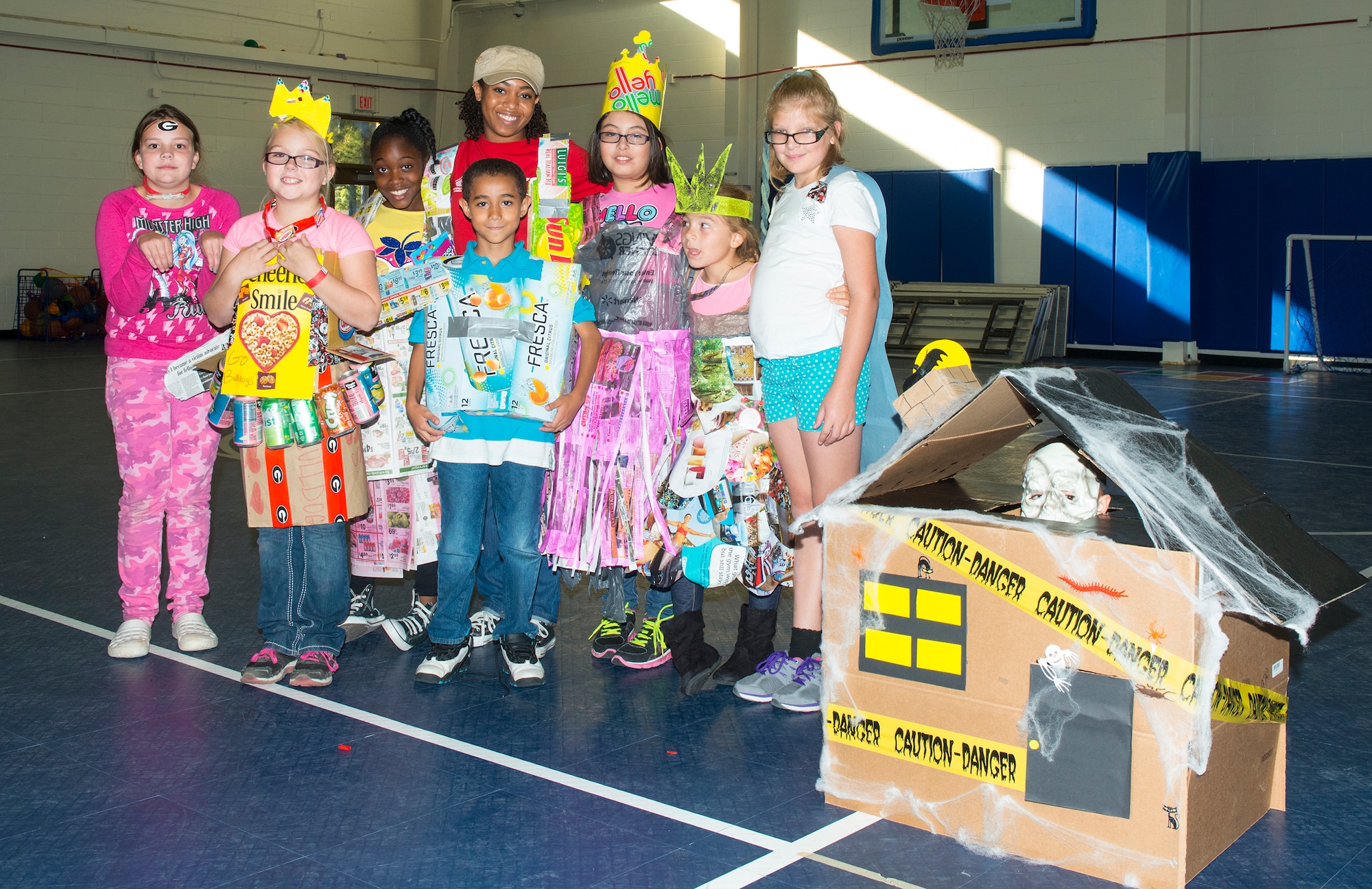 Energy Action Month Costume Contest participants pose for a photo Oct. 24, 2014, at Moody Air Force Base, Ga. Participants designed their Halloween costumes using only recycled materials. (U.S. Air Force photo by Airman 1st Class Ceaira Tinsley/Released)