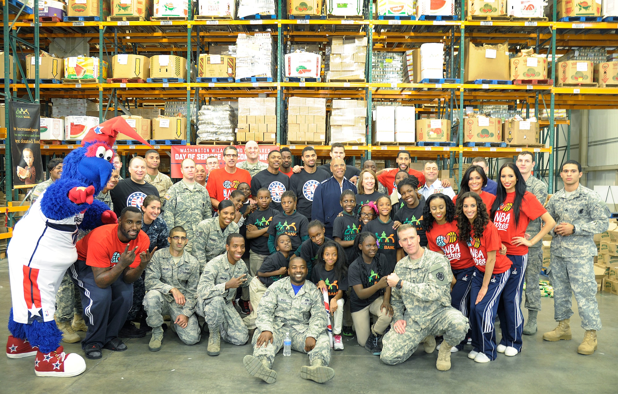 Vice Chief of Staff of the U.S. Air Force Gen. Larry O. Spencer and service members from across the National Capital Region spent the afternoon packing bags with members of the Washington Wizards and students from Browne Educational Campus as part of the NBA’s Commitment to Service initiative at the Capital Area Food Bank in Washington, D.C., Oct 24, 2014. This event helped roll out the NBA’s commitment to service initiative. (U.S. Air Force photo/Mike Martin)