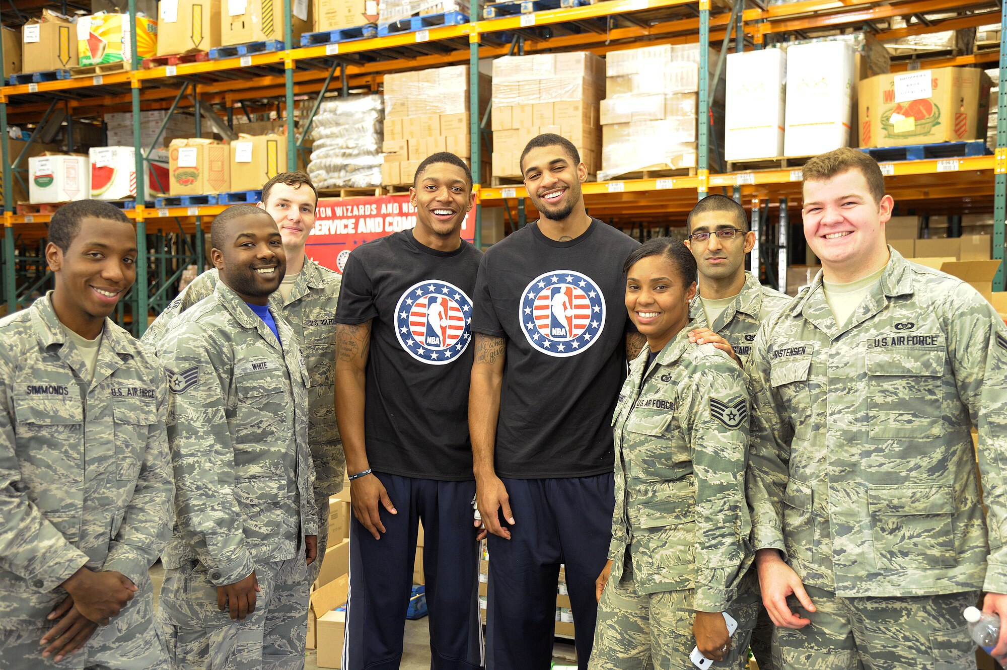 Airmen from Air Force District of Washington spent the afternoon at the Capital Area Food Bank in Washington, D.C., packing bags with members of the Washington Wizards as part of the NBA’s Commitment to Service initiative Oct. 24, 2014. The initiative focuses on building a culture of service by meeting local needs through community service projects done jointly between NBA teams and the U.S. military. (U.S. Air Force photo/ Mike Martin)