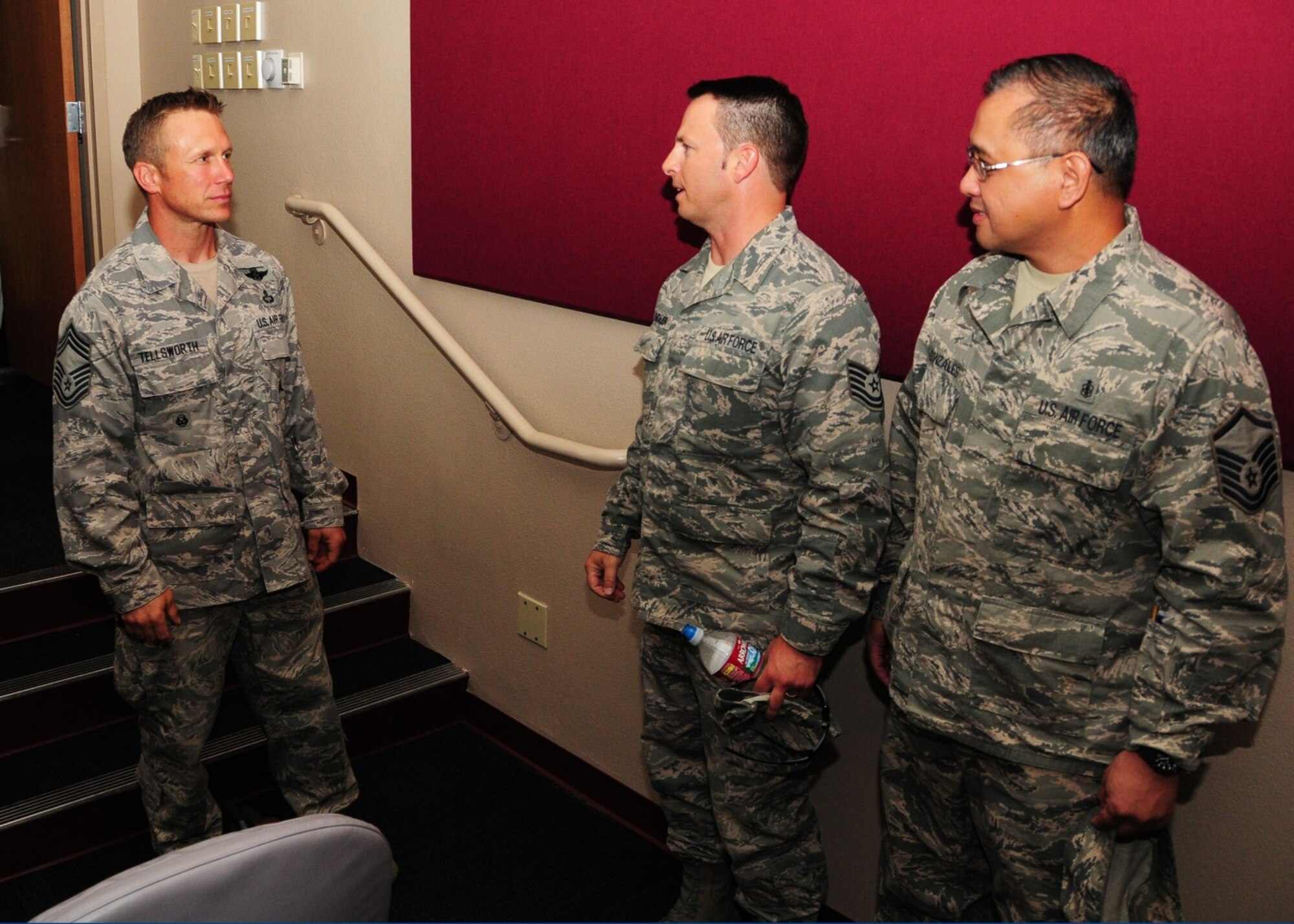 Chief Master Sgt. Christopher Tellsworth speaks with Tech. Sgt. Cory Schidler, 944th Medical Squadron medical technician and Master Sgt. Miguel Gonzales, 944th Medical Squadron administrative technician Oct 19 after a recruiting effort brief at Luke Air Force Base, Ariz. (U.S. Air Force photo taken by Tech. Sgt. Louis Vega Jr.)