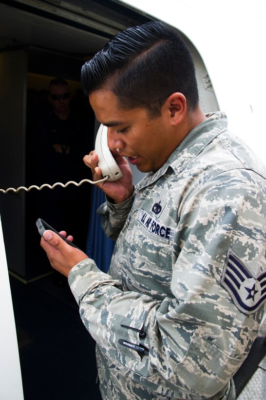 ROBERTS INTERNATIONAL AIRPORT, Republic of Liberia - U.S. Air Force Staff Sgt. Daniel Gonzalez, an aerial porter with the Joint Task Force-Port Opening team of the 621st Contingency Response Wing stationed at Joint Base McGuire-Dix-Lakehurst, N.J., briefs members of the U.S. Public Health Service after arriving here, during Operation UNITED ASSISTANCE, October 27, 2014. The medical staff of the USPHS will aid Ebola patient medical staff who need medical care. OUA is a U.S. Africa Command-led operation to provide command and control, logistics, training and engineering support to the U.S. government’s efforts to contain the Ebola virus outbreak in West African nations. (U.S. Air Force photo/Staff Sgt. Gustavo Gonzalez/RELEASED)