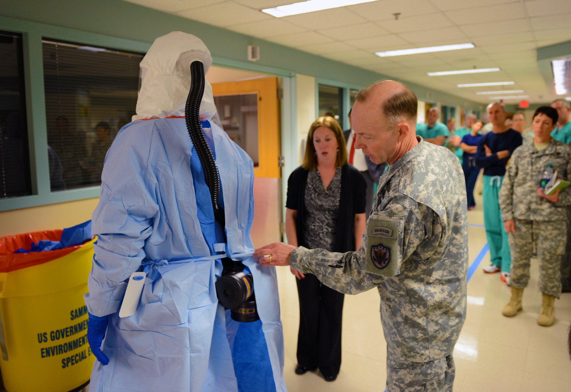 Army Gen. Charles H. Jacoby Jr., right, commander of U.S. Northern Command and NORAD, observes an instructor during the DoD medical support team training at the San Antonio Military Medical Center in San Antonio, Texas, Oct. 24, 2014. The students are part of a 30-person team designated for “prepare to deploy” status in the event of an Ebola crisis in the U.S. (DoD photo/Army Sgt. 1st Class Tyrone C. Marshall Jr.) 
