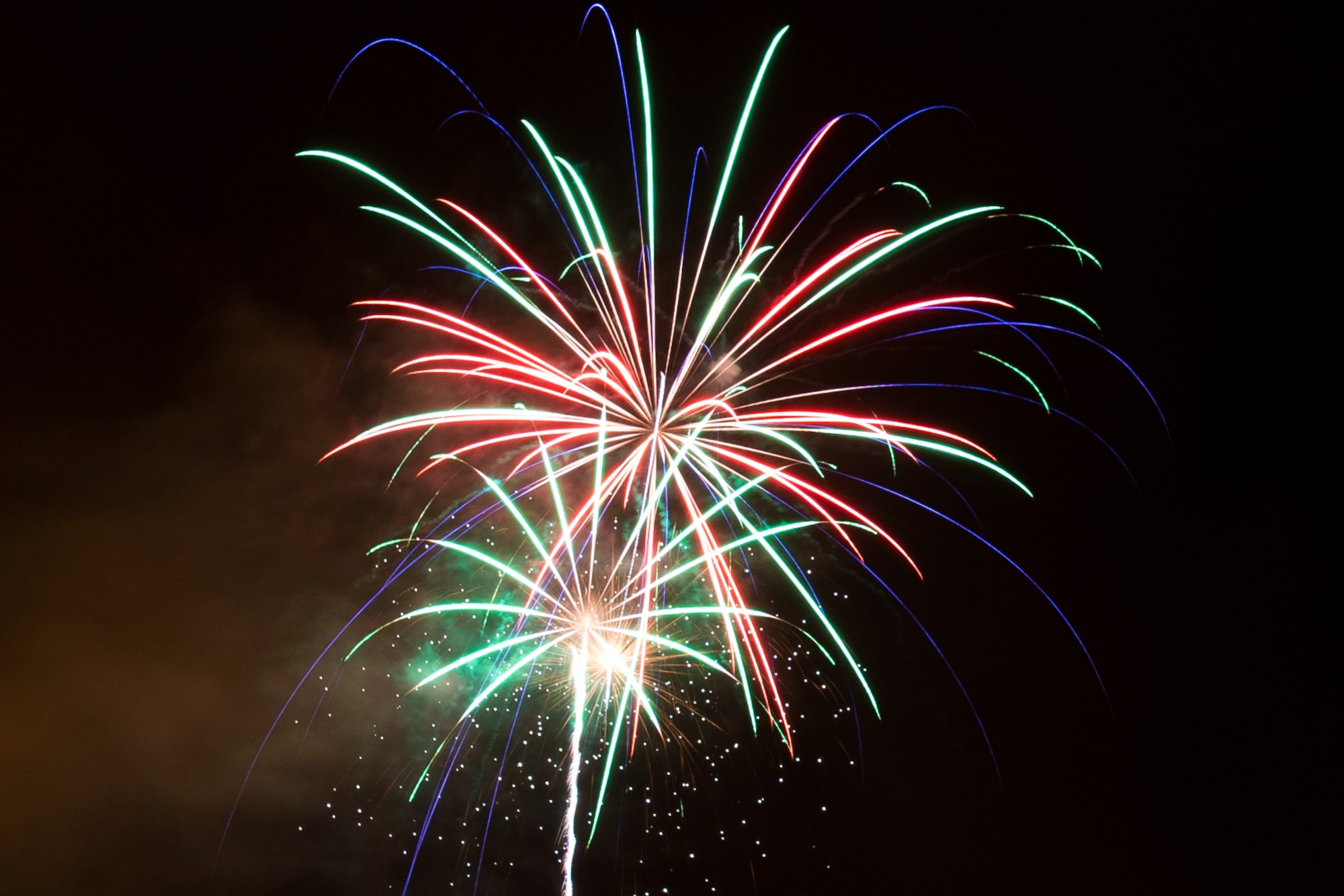 Fireworks burst over Eielson Air Force Base, Alaska, during the fall festival Oct. 23, 2014.  The festival is an annual event on base consisting of games, prizes and the fireworks show.  (U.S. Air Force photo by Tech. Sgt. Joseph Swafford/Released)