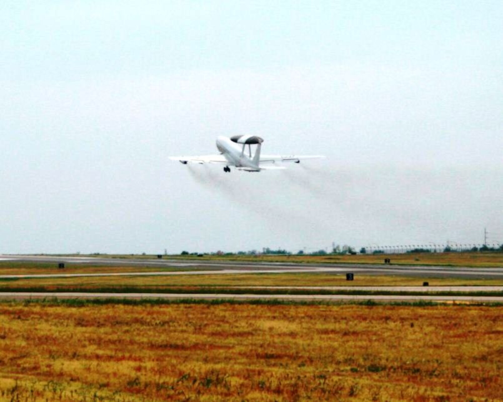 It's lift off for the E-3 AWACS DMS Replacement of Avionics for Global Operation Navigation (DRAGON) program, as the D-1 test aircraft takes off from Tinker Air Force Base, Okla., on its way to Boeing Field in Seattle. The D-1 handover effort successfully concluded Oct. 22, 2014. The D-1 aircraft will first undergo a three-month demodification process followed by a modification Installation & Checkout phase that will conclude with a planned D-1 DRAGON delivery in early 2017.  CNS/ATM DRAGON is a cooperative program with NATO that addresses DMS equipment issues and known CONUS and International Air Traffic Management restrictions, ensuring operational viability of the both E-3 fleets for worldwide operations and will provide unrestricted worldwide access to global airspace. The DRAGON program falls under the Air Force Life Cycle Management Center's Battle Management directorate located at Hanscom AFB, Mass. (Courtesy photo by David Clavey)