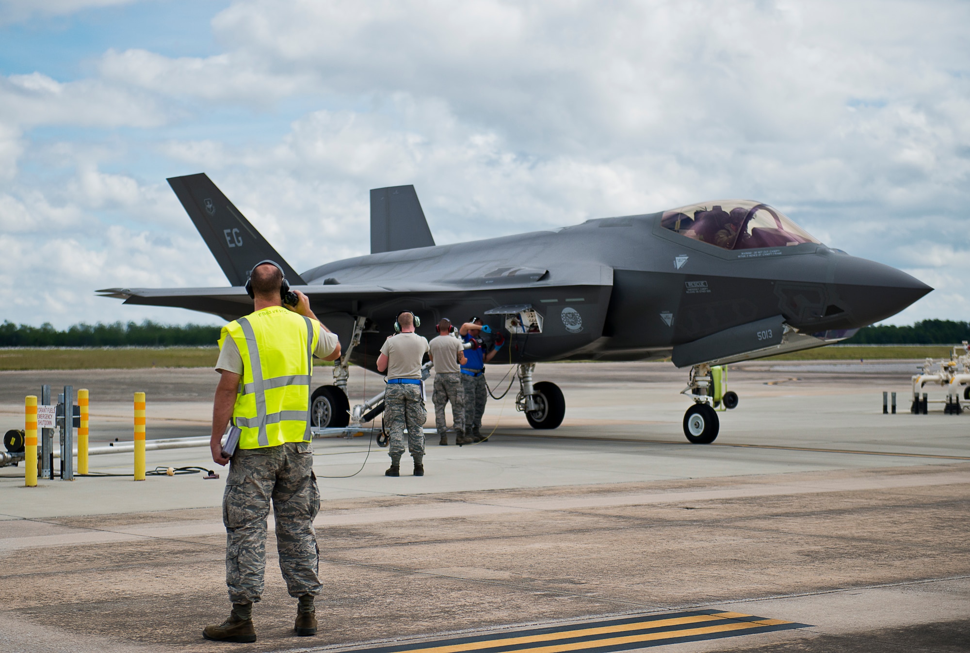 Airmen begin refueling an F-35A Lightning II during a hot pit session on the 33rd Fighter Wing flightline at Eglin Air Force Base, Fla.  All of the F-35 variants use the refueling areas in conjunction with the 96th Logistics Readiness Squadron’s fuels flight. (U.S. Air Force photo/Samuel King Jr.)