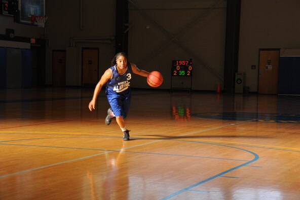 Nicole Holman goes through a drill during All Air Force women’s basketball tryouts at Maxwell Air Force Base Oct. 21. The team hopefuls will spend the next two weeks doing two practices a day, all while being evaluated by the coaches, who will decide whether they go back to their bases or continue on to the tournament. (U.S. Air Force photo by Senior Airman William Blankenship)