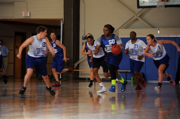 Tiffany Gunthrie pushes the ball up the court in a scrimmage during All Air Force women’s basketball tryouts at Maxwell Air Force Base Oct. 20. The team must quickly learn to play together as the potential members are stationed around the world. (U.S. Air Force photo by Senior Airman William Blankenship)