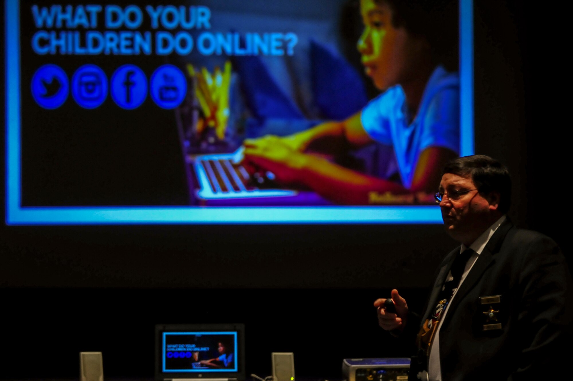 Police Lt. Thomas Flores, Wayne County Sheriff’s Office financial crimes unit, gives a briefing during a social media seminar at Seymour Johnson Air Force Base, North Carolina, Oct. 16, 2014. Flores talked to members of Team Seymour about the negative impacts of online networking, including sexting, cyber bullying and exposure to inappropriate content. (U.S. Air Force photo/Airman 1st Class Brittain Crolley)