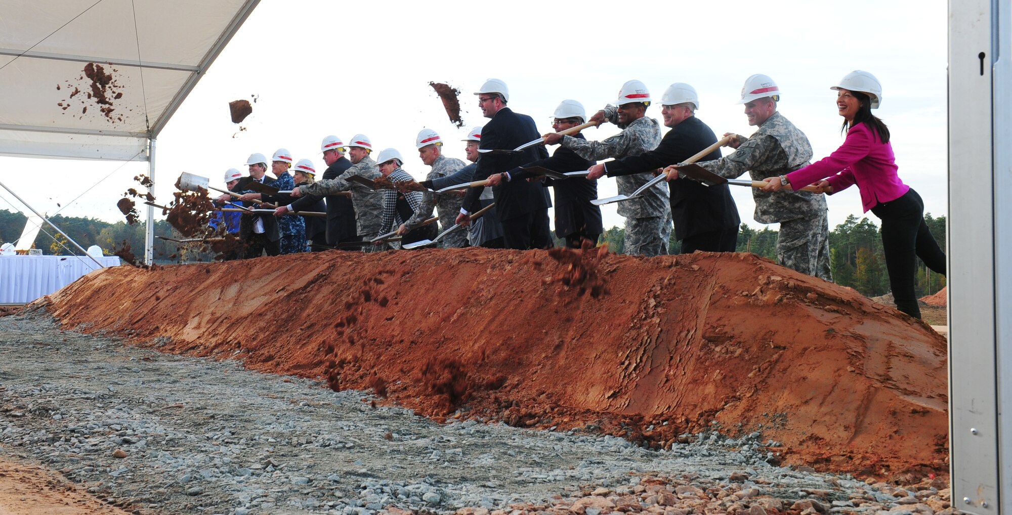 Senior U.S. military leaders, German dignitaries and former wounded U.S. servicemembers turn the first shovels of earth Oct. 24. 2014, to mark the start of construction of the Rhine Ordnance Barracks Medical Center Replacement that will replace Landstuhl Regional Medical Center and the Ramstein Air Base Clinic. (U.S. Army Photo/Sgt. Daniel Cole)