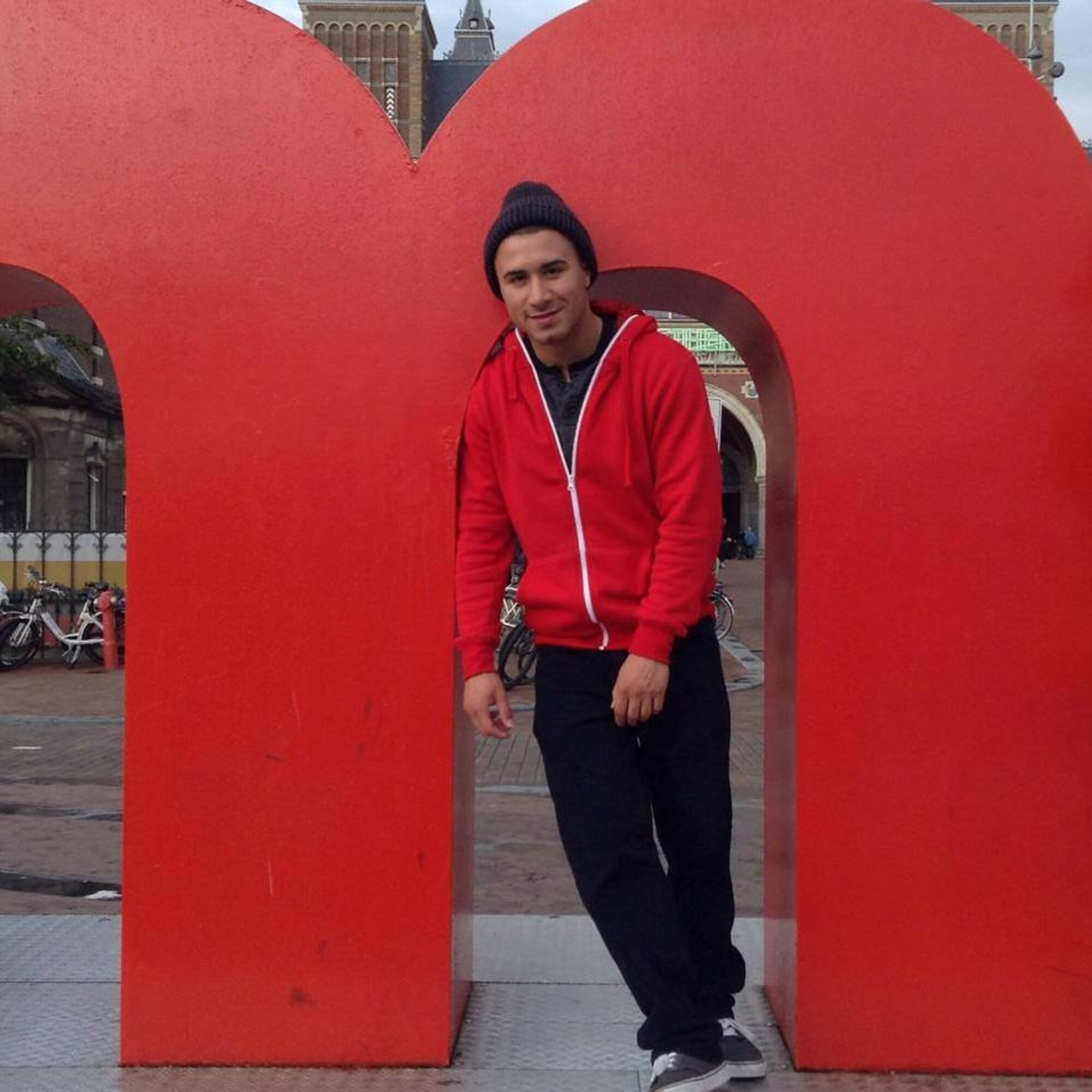 Senior Airman Giovanni Pinzon, a former 86th Ammunitions Squadron conventional maintenance crew chief, has his photo taken inside the M of the I Am Amsterdam sign after a recent trip to Amsterdam, The Netherlands. Pinzon is an advocate of frequent travels as a way to increase morale. (Courtesy photo)