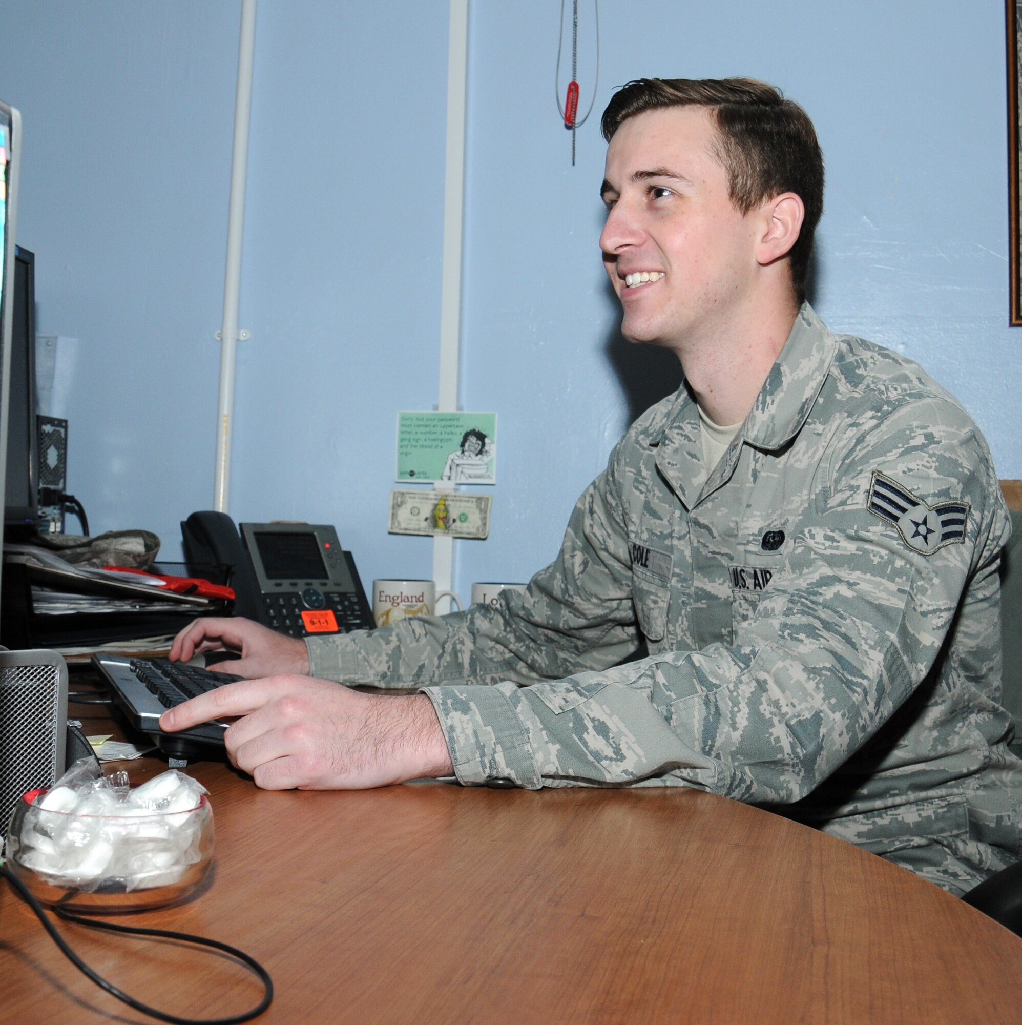 U.S. Air Force Senior Airman Christopher Cole, 100th Communication Squadron cyber transport technician from Merced, Calif., remotes into a switch Sept. 17, 2014, on RAF Mildenhall, England. If a port is tripped, Cole can un-trip the port that has already been patched. This saves Cole time and a trip to the building where the workstation is located. (U.S. Air Force photo by Gina Randall/Released)
