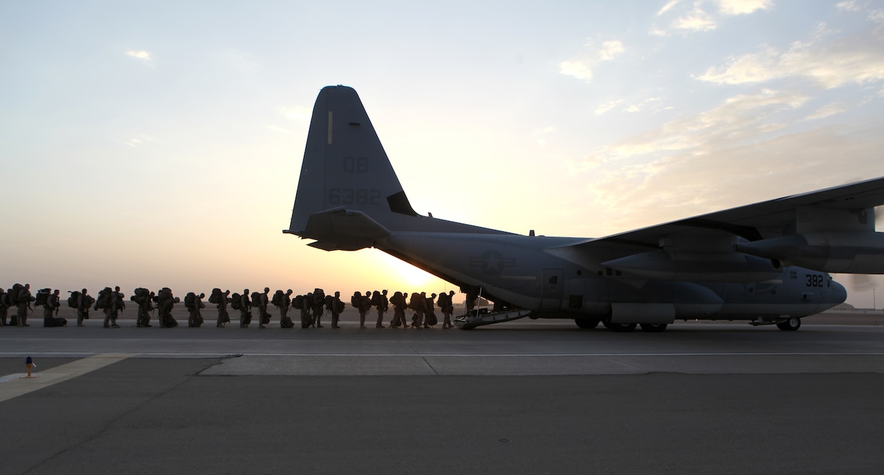 Marines and sailors with Marine Expeditionary Brigade Afghanistan load onto a KC-130 aircraft at Camp Bastion in Afghanistan’s Helmand province, Oct. 27, 2014. The Marine Corps ended its mission in Helmand province the day prior. U.S. Marine Corps photo by Staff Sgt. John Jackson