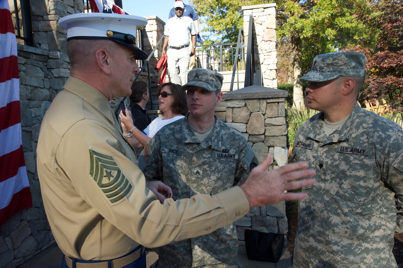 Marine Corps Sgt. Maj. Bryan B. Battaglia, the senior enlisted advisor to the chairman of the Joint Chiefs of Staff, with members of the Maryland Army National Guard before a “Birdies for the Brave” golf tournament at Tournament Players Club Potomac in Maryland, Oct. 27, 2014. DoD photo by Army Master Sgt. Terrance L. Hayes