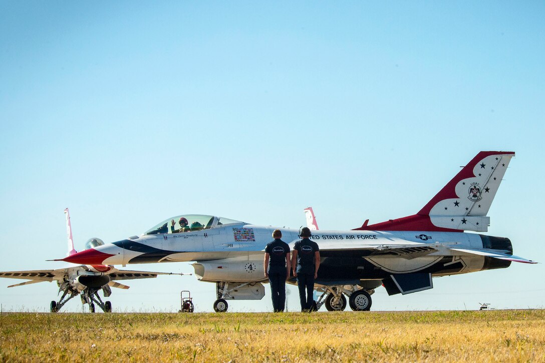 Maintenance professionals send off pilots from the U.S. Air Force demonstration squadron, The Thunderbirds, Delta Formation during the Alliance Air Show in Forth Worth, Texas, Oct. 25, 2014. 