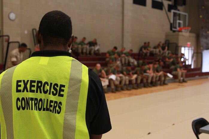 DoD personnel and U.S. Marines participate in Exercise Vigilant Response 2014 (VR14) aboard Marine Corps Air Station New River, N.C., Oct. 7, 2014. VR14 was a two-day exercise designed to test the ability to conduct command and control measures in response to a pandemic outbreak aboard the Air Station.
