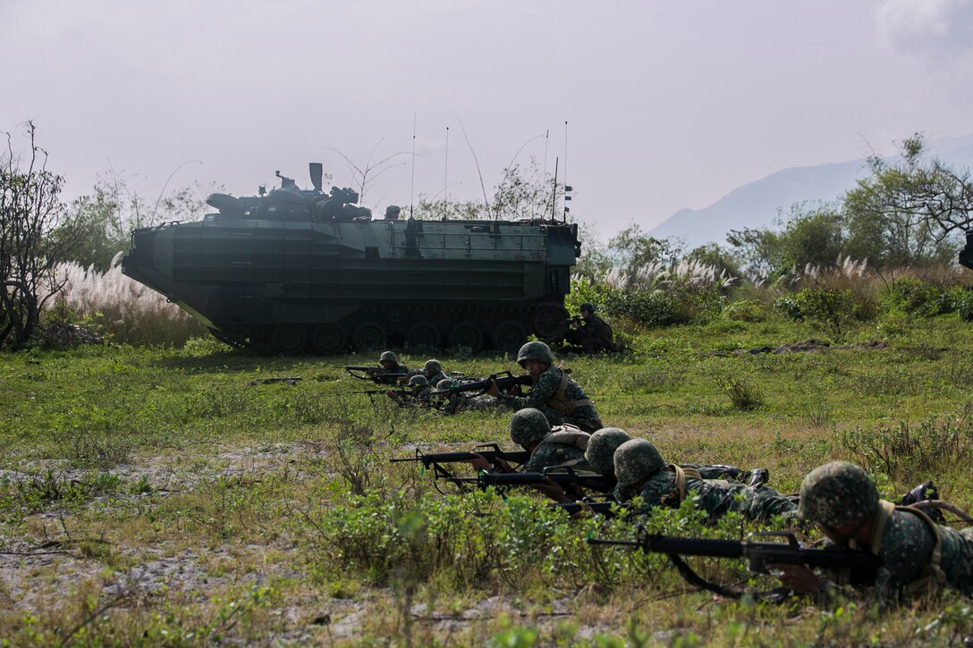 Philippine and U.S. Marines  provide supporting fire with U.S. Marine Amphibious Assault Vehicles to simulate suppressing enemy forces during a mechanized assault as part of Amphibious Landing Exercise 15 at Naval Education Training Command, Zambales, Luzon, Philippines, Oct. 5. PHIBLEX is an annual, bilateral training exercise conducted by members of the Armed Forces of the Philippines alongside U.S Marine and Navy Forces focused on strengthening the partnership and relationships between the two nations across a range of military operations including disaster relief and complex expeditionary operations. The U.S. Marines are with Company I, Battalion Landing Team 3rd Battalion, 5th Marines, 31st Marine Expeditionary Unit, 3rd Marine Expeditionary Brigade. The Philippine Marines are with 4th Marine Company, Battalion Landing Team - 9. (U.S. Marine Corps photo by Lance Cpl. Tyler S. Giguere/Released)
