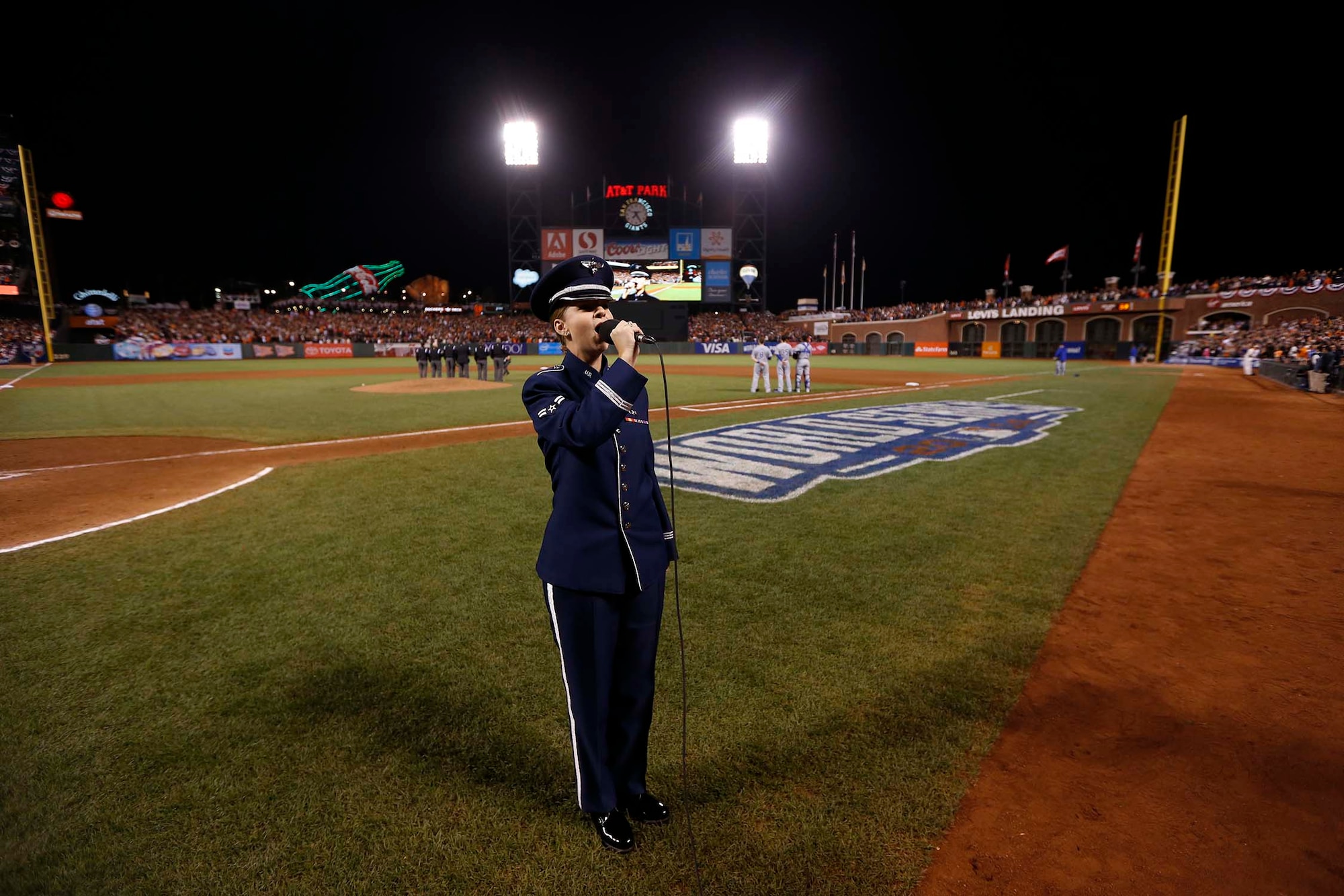 Airman 1st Class Michelle Doolittle sings "God Bless America" Oct. 26, 2014, during the seventh-inning stretch of Game 5, of the 2014 World Series. She represented the Airmen from Travis Air Force Base, California and the Air Force at the game. Doolittle is an Air Force Band of the Golden West vocalist. (Courtesy photo)