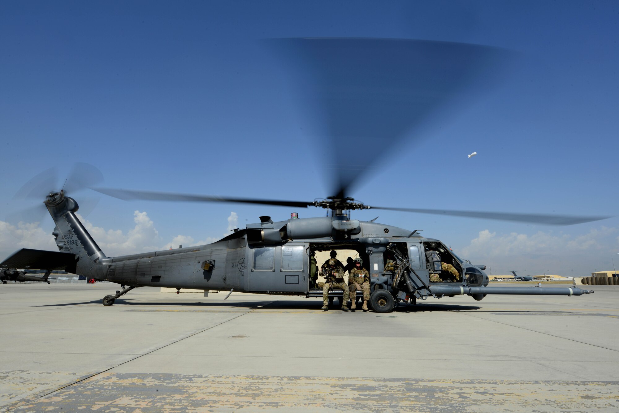 A U.S. Air Force HH-60 Pavehawk helicopter prepares for take off at Bagram Airfield, Afghanistan Sept. 8, 2014.  Deployed service members help operate 46 different types of aircraft in-and-out of the buisiest single runway airfield in the Department of Defense. (U.S. Air Force photo by Staff Sgt. Evelyn Chavez/Released)