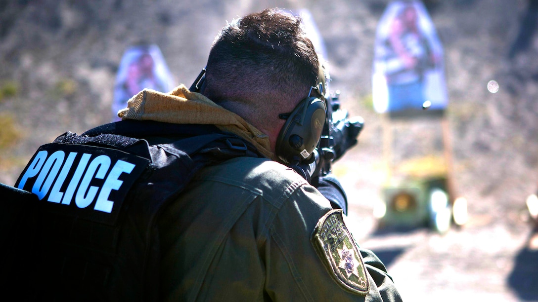 Cpl. Tyler Raffaele, an enter team member of the Provost Marshall Office Special Reaction Team, engages a target holding a hostage during a live-fire training evolution at Range 300, Oct. 23.  The SRT is responsible for any critical situations that fall beyond the capabilities of ordinary law enforcement. 