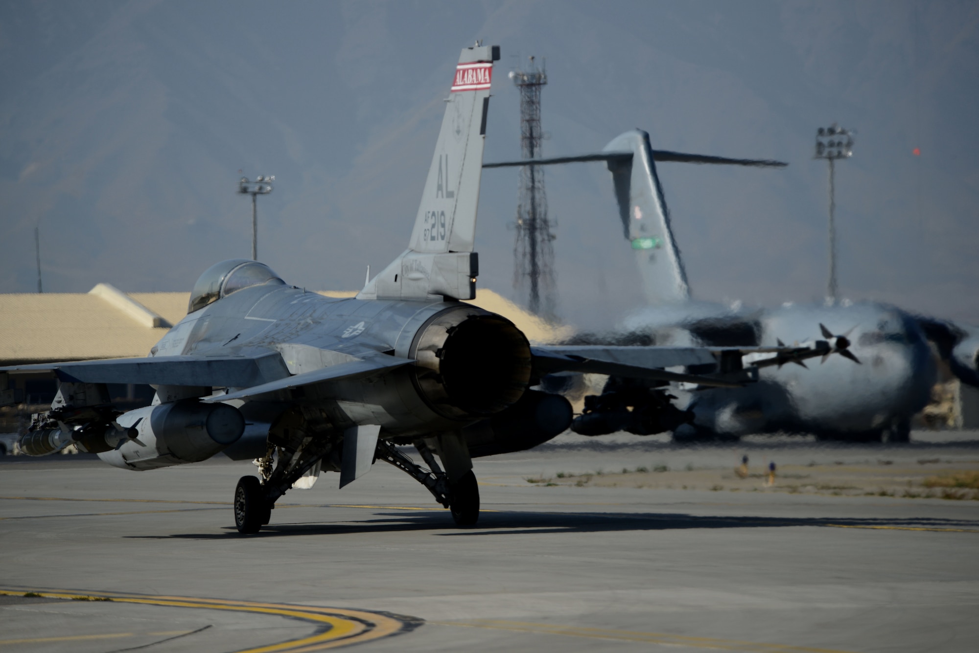 A U.S. Air Force F-16C Fighting Falcon prepares for take off at Bagram Airfield, Afghanistan Oct. 24, 2014.  Deployed service members help operate 46 different types of aircraft in-and-out of the buisiest single runway airfield in the Department of Defense. (U.S. Air Force photo by Staff Sgt. Evelyn Chavez/Released)
