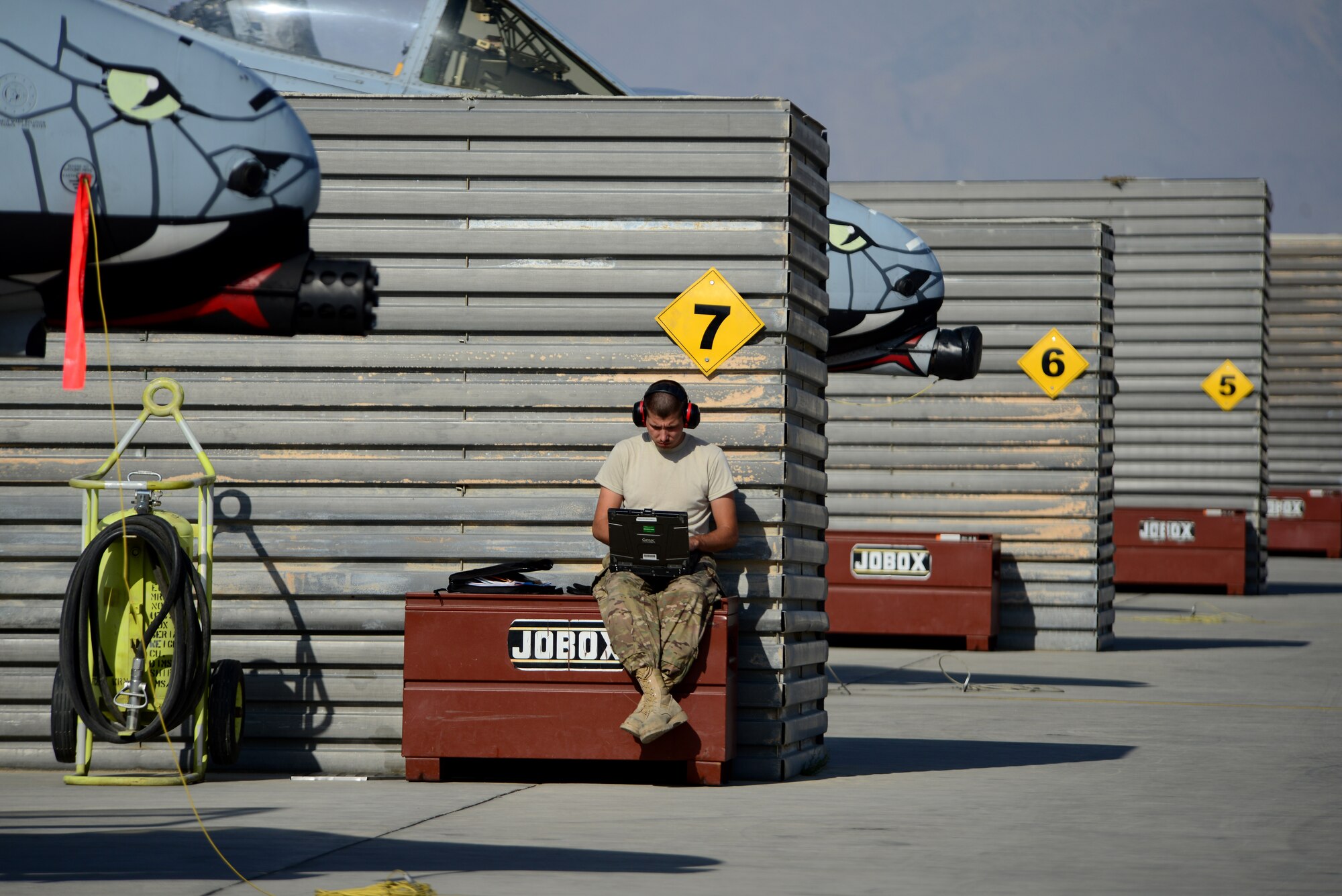 U.S. Air Force Staff Sgt. Shaun Schaud, 455th Expeditionary Aircraft Maintenance electrical and environmental technician, reviews a technical order at Bagram Airfield, Afghanistan Oct. 24, 2014.  Schaud deployed from Fort Wayne, Indiana Air National Guard, is responsible for ensuring the A-10 is mission ready and able to perform close air support mission throughout Afghanistan in support of Operation Enduring Freedom. (U.S. Air Force photo by Staff Sgt. Evelyn Chavez/Released)