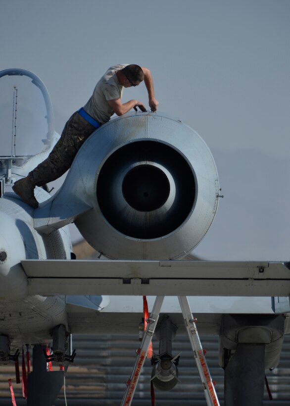 A U.S. Air Force Airman with the 455th Expeditionary Maintenance Squadron ensures an A-10 Thunderbolt aircraft is ready for a flying mission at Bagram Airfield, Afghanistan Oct. 24, 2014. Maintainers are responsible for having the aircraft ready to fly at a moment’s notice.  (U.S. Air Force photo by Staff Sgt. Evelyn Chavez/Released)