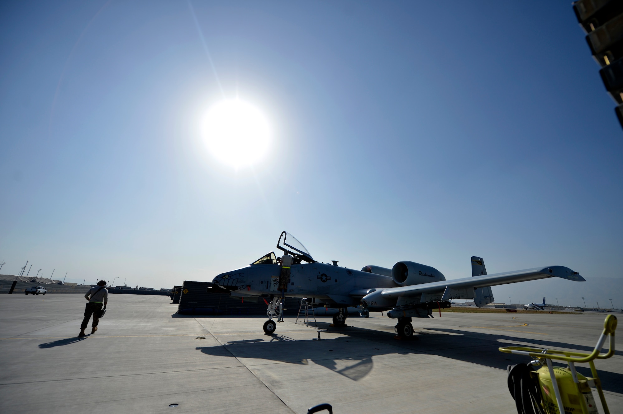 U.S. Air Force Airmen with the 455th Expeditionary Maintenance Squadron ensure an A-10 Thunderbolt aircraft is ready for a flying mission at Bagram Airfield, Afghanistan Oct. 24, 2014. Maintainers are responsible for having the aircraft ready to fly at a moment’s notice.  The Airmen are deployed from Fort Wayne, Indiana Air National Guard in support of Operation Enduring Freedom. (U.S. Air Force photo by Staff Sgt. Evelyn Chavez/Released)