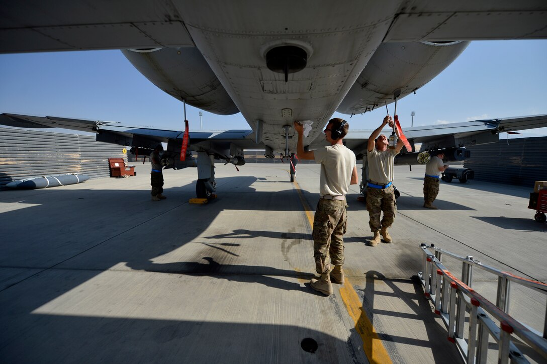 U.S. Air Force Airmen with the 455th Expeditionary Maintenance Squadron ensure an A-10 Thunderbolt aircraft is ready for a flying mission at Bagram Airfield, Afghanistan Oct. 24, 2014. Maintainers are responsible for having the aircraft ready to fly at a moment’s notice.  The Airmen are deployed from Fort Wayne, Indiana Air National Guard in support of Operation Enduring Freedom. (U.S. Air Force photo by Staff Sgt. Evelyn Chavez/Released)