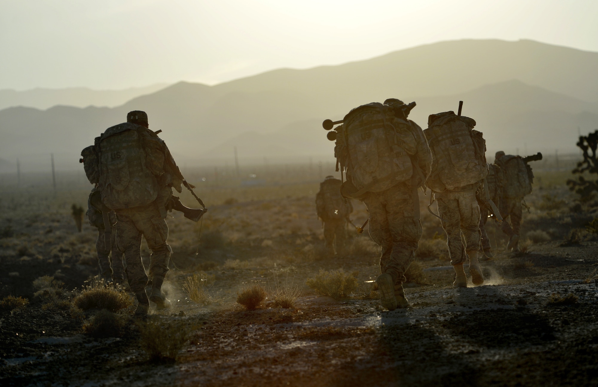 Ranger Assessment Course students conduct a foot patrol Oct. 10, 2014, at Silver Flag Alpha range, Nev. RAC is the first step for Airmen who want to go to U.S. Army Ranger School. About 80 percent of Airmen who graduate RAC and go to Ranger School complete it and receive the Ranger tab. (U.S. Air Force photo/Airman 1st Class Christian Clausen)