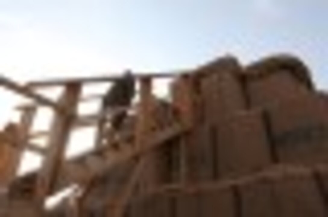 An Afghan National Army soldier with the ANA’s 215th Corps walks upstairs to a guard tower on the perimeter of Camp Leatherneck, Afghanistan, Oct. 27, 2014. The United States Marine Corps ended their operations in Helmand province, Afghanistan, and transferred the base to the ANA.