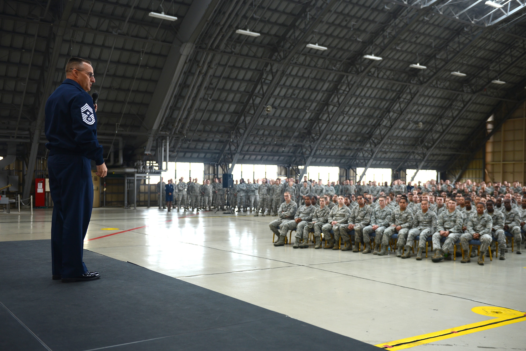 Chief Master Sgt. Harold Hutchison, Pacific Air Force command chief, talks to hundreds of Airmen at Yokota Air Base, Japan, Oct. 23, 2014. The new PACAF command chief shared his goals and thanked Airmen for what they do every day. (U.S. Air Force photo by Airman 1st Class David Danford/Released)