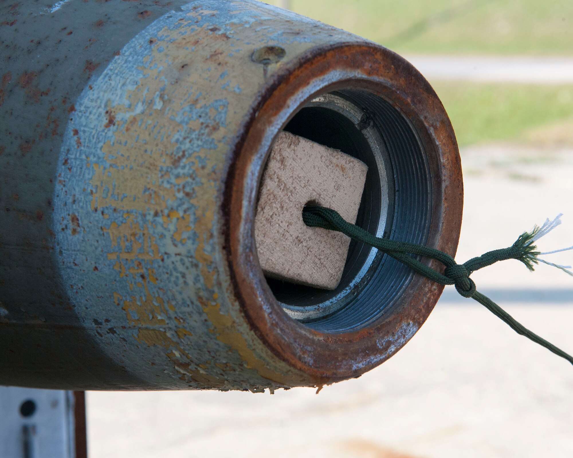 The above image shows a Mark-82 bomb attached to a detonation cord at the Kunsan Air Base Munitions Storage Area, following a successful emergency destruction of munitions simulation, Oct. 23, 2014. Airmen from the 8th Maintenance Squadron simulated destroying facilities through EDM – a measure used to prevent enemies from gaining access to critical munitions assets to use against the U.S. Armed Forces and its allies. (U.S. Air Force photo by Senior Airman Katrina Heikkinen/Released)