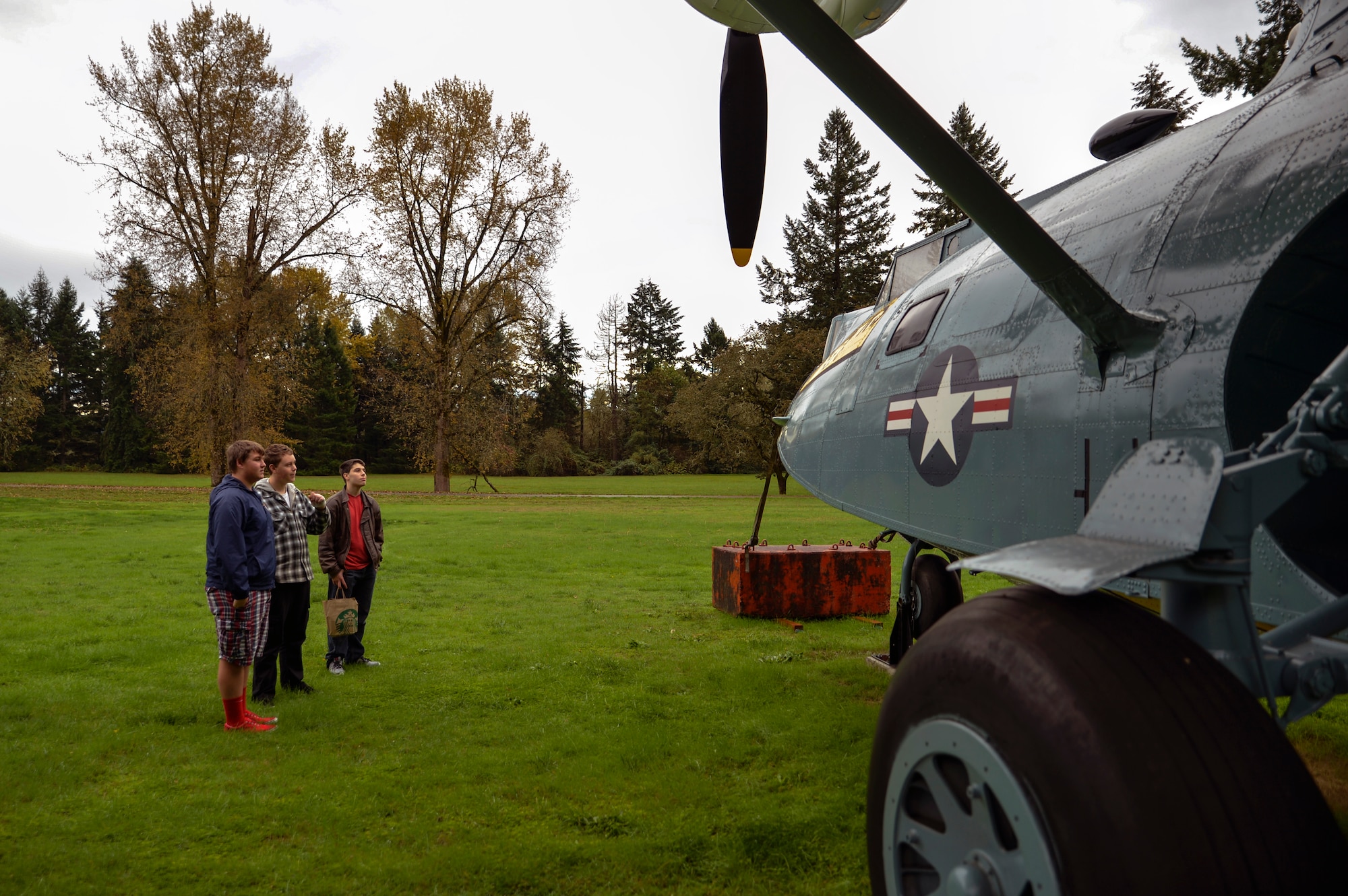 Students from the Aviation Explorer Post 1735 study a Consolidated SA-10 Catalina at the McChord Air Museum on Heritage Hill October 25, 2014, during their tour of Joint Base Lewis-McChord, Wash.  The Aviation Explorer Post 1735 is comprised of a small group of students with interests in the field of aviation from the Gig Harbor, Wash. area who are between the ages of 14 and 20 years old. (U.S. Air Force photo/Airman 1st Class Keoni Chavarria)