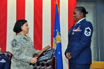 TRAVIS AIR FORCE BASE, Calif. -- Senior Master Sgt. Veronica Cador, chief of customer support for the 349th Force Support Squadron retired after 33 years of service on October 25, 2014, at Travis Air Force Base, Calif. (U.S. Air Force photos/Staff Sgt. Cindy G. Alejandrez)