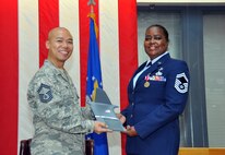 TRAVIS AIR FORCE BASE, Calif. -- Senior Master Sgt. Veronica Cador, chief of customer support for the 349th Force Support Squadron retired after 33 years of service on October 25, 2014, at Travis Air Force Base, Calif. (U.S. Air Force photos/Staff Sgt. Cindy G. Alejandrez)