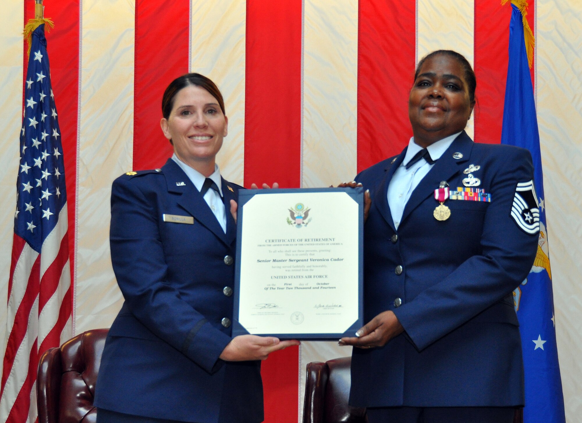 TRAVIS AIR FORCE BASE, Calif. -- Senior Master Sgt. Veronica Cador, chief of customer support for the 349th Force Support Squadron retired after 33 years of service on October 25, 2014, at Travis Air Force Base, Calif. (U.S. Air Force photos/Staff Sgt. Cindy G. Alejandrez)