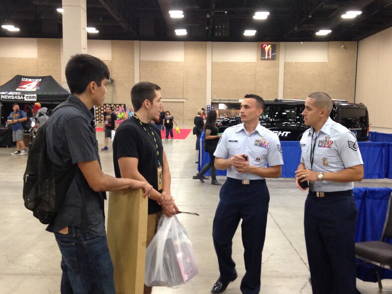 Staff Sgt. Misael Torres and Staff Sgt. Adrian Rodriguez (right), 341st Recruiting Squadron B-Flight recruiters, speak to visitors at the Alamo City Comic Con in San Antonio, Sept. 26. The event, held at the Henry B. Gonzalez Convention Center, attracted more than 65,000 people. (U.S. Air Force photo)