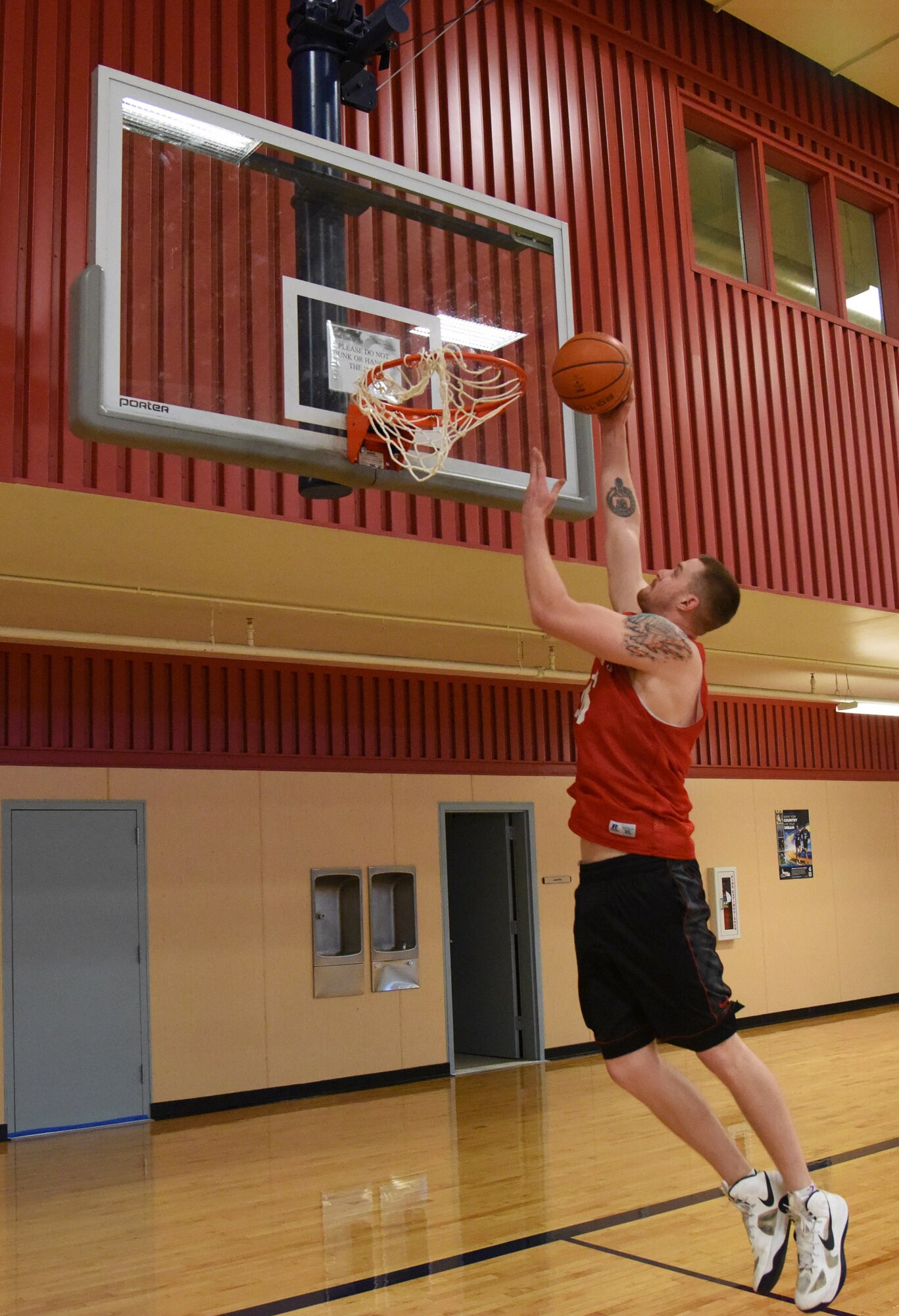 Senior Airman John Robertson, 741st Missile Security Forces Squadron convoy response force leader, performs a lay-up Oct. 17 at the Malmstrom Air Force Base fitness center. Robertson, 22, is one out of 22 Airmen selected to try out for the Air Force men’s basketball team. (U.S. Air Force photo/Airman 1st Class Joshua Smoot)